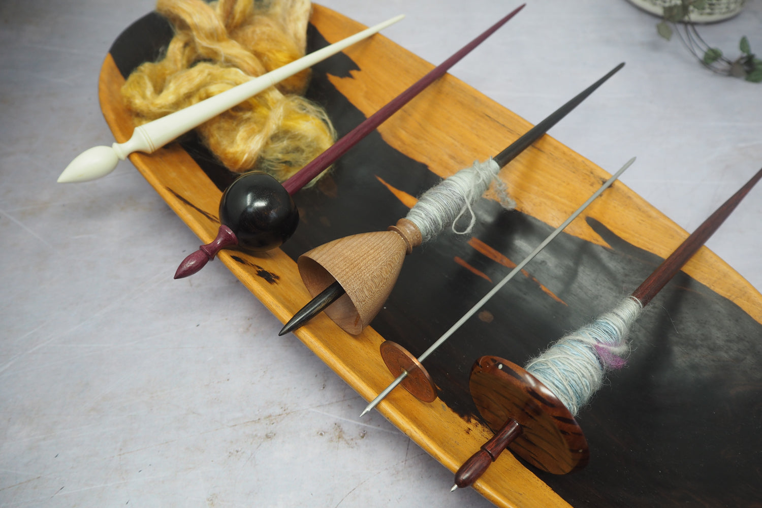 Five supported spindles in a row - A Russian, 2 Tibetans, a thakli and another Tibetan.