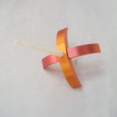 A 3d-printed Turkish drop spindle in gilded rose