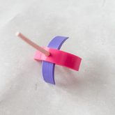 Pink and purple 3d printed Turkish spindle on a white background