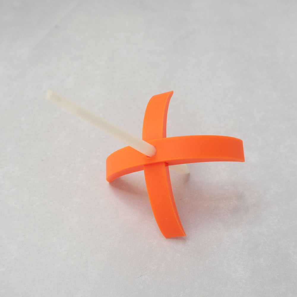 A 3d-printed Turkish drop spindle in orange