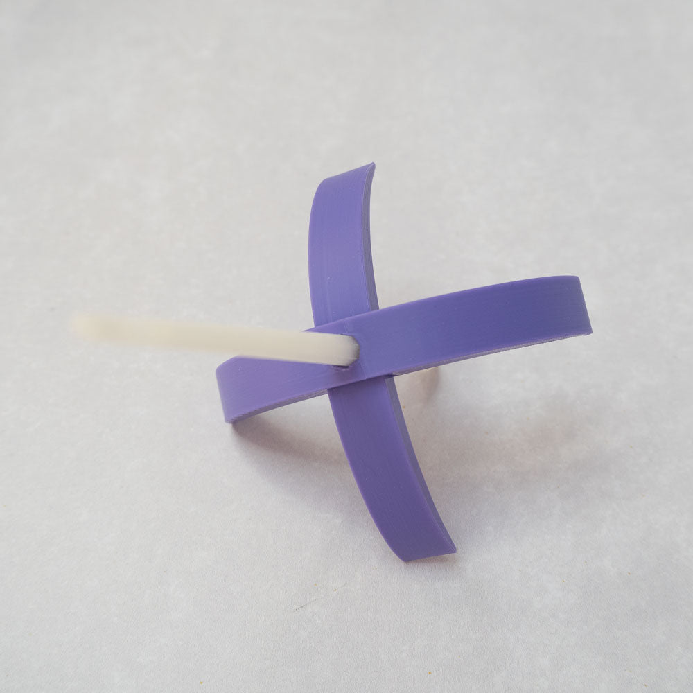 A 3d-printed Turkish drop spindle in lavender.