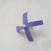 A 3d-printed Turkish drop spindle in lavender.