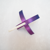 A shimmering purple Turkish drop spindle
