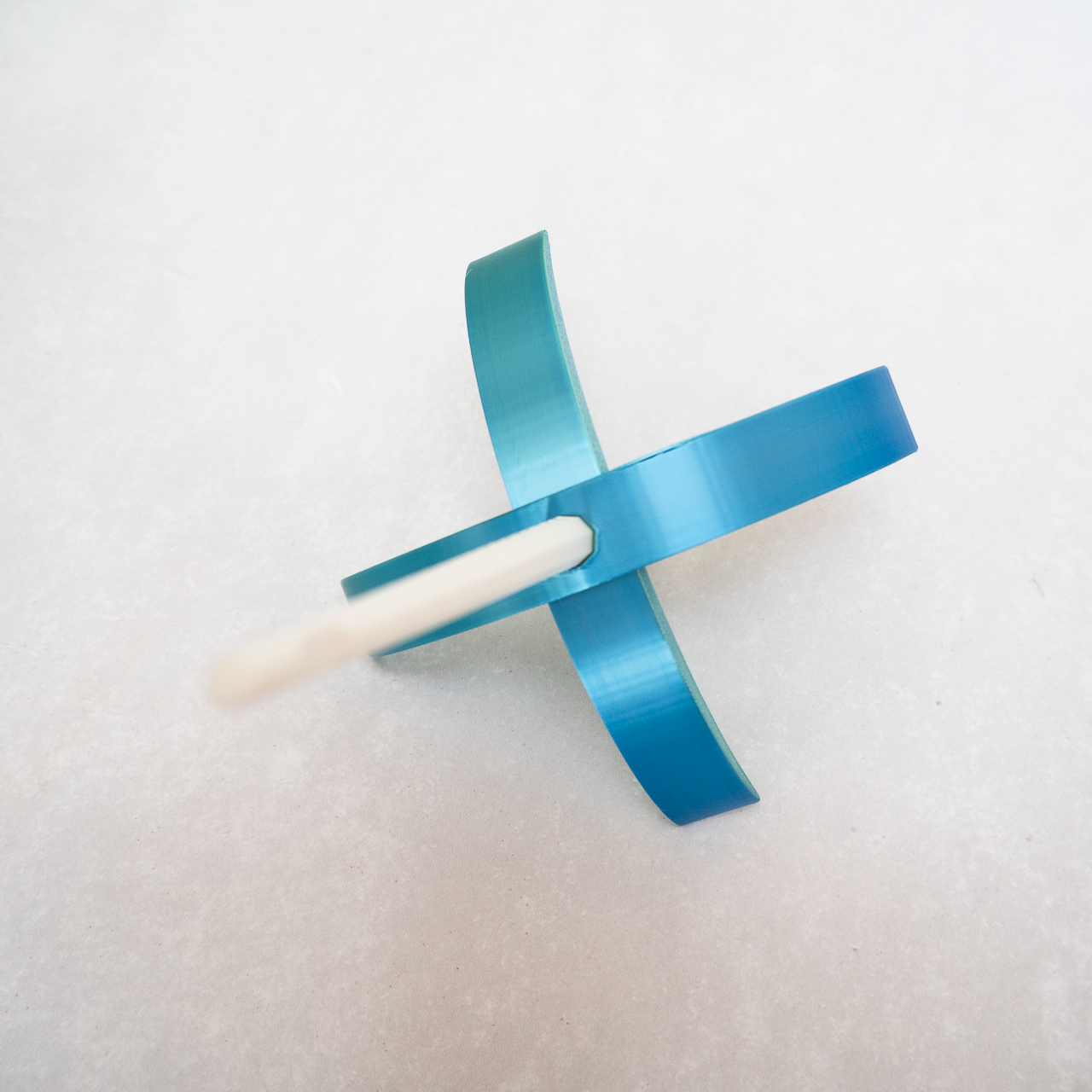 A shinmering blue Turkish Drop spindle